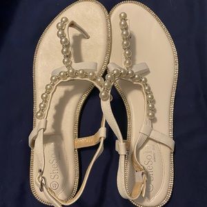 White sandals size 41, fits like a size 11 US.